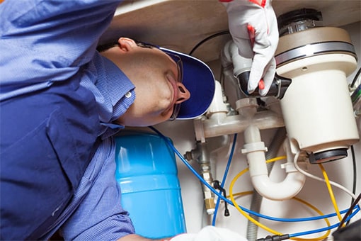 Plumber Repairing Damaged Garbage Disposal in Easton Pennsylvania