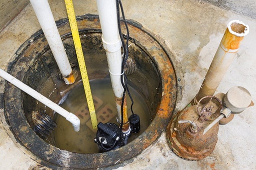 Flooded Sump Pump in Bethlehem PA Being Repaired by Allentown Plumber