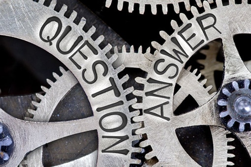 Gears Painted with "Questions" and "Answers" Signifying Sump Pump Repair FAQs in Emmaus PA