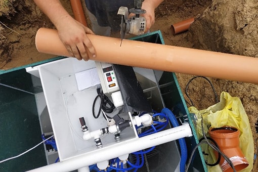 Skilled Plumber Repairing Sump Pump at a House in Forks Township Pennsylvania