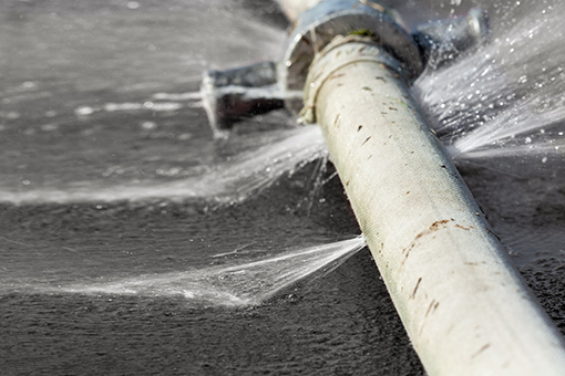 Water Coming Out of Leaking Pipe That Needs Schnecksville Commercial Plumber's Services