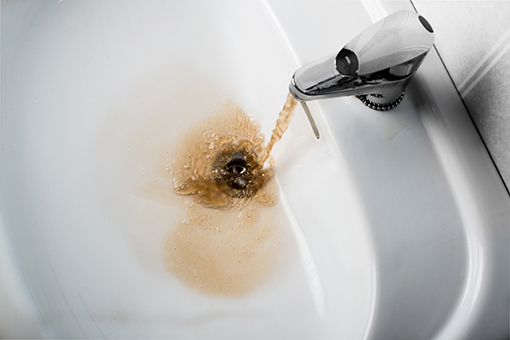 Dirty Water Coming Off the Faucet of a Slatington Business That Needs Commercial Plumber