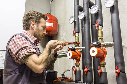 Commercial Plumber Tightening Pipe of a Commercial Business in Slatington PA